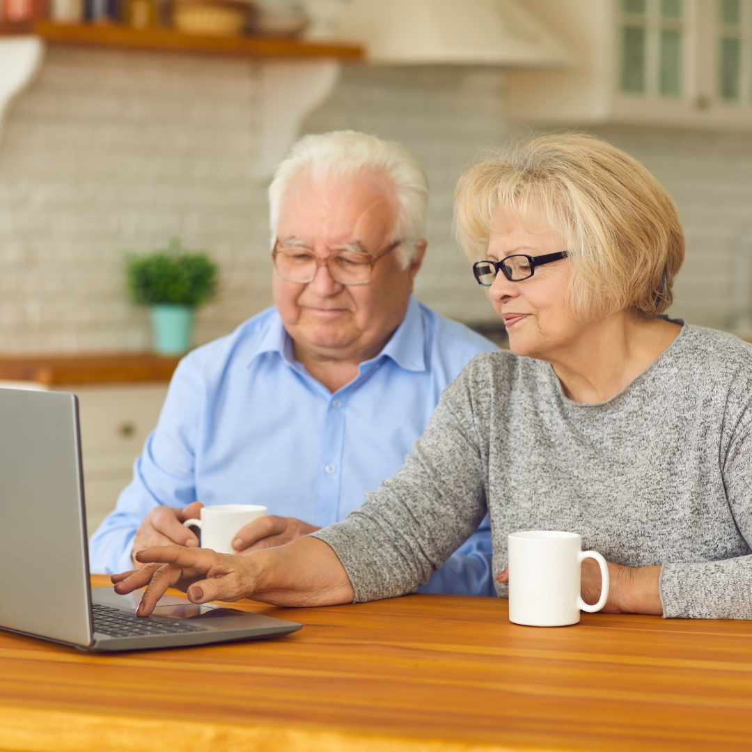 Diverse group of seniors smiling in a retirement community setting