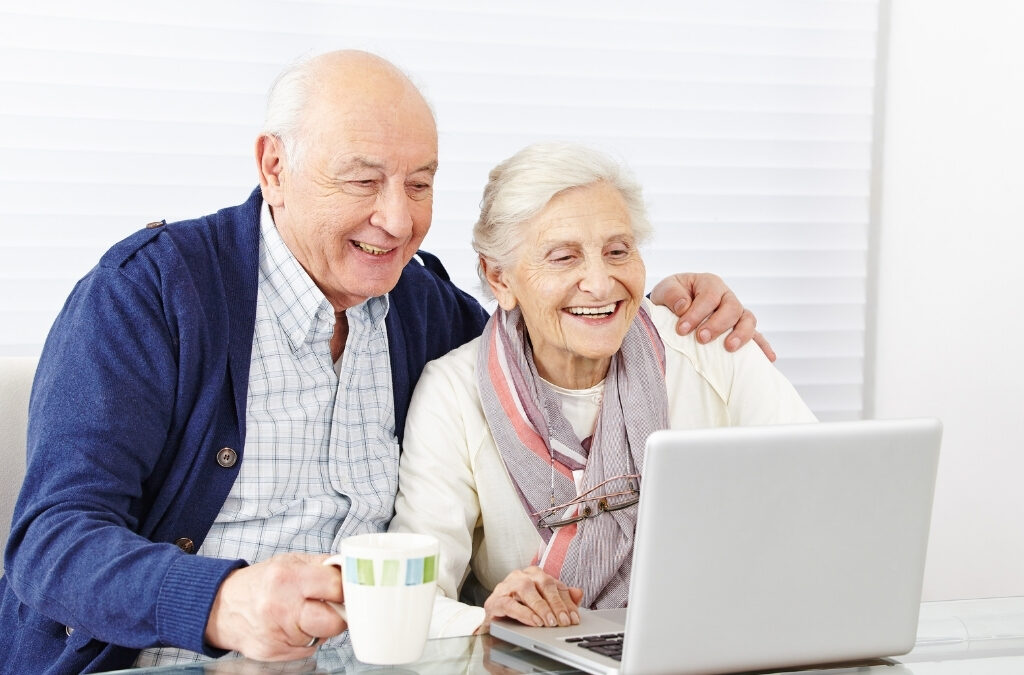 Family researching senior living options online before scheduling a tour