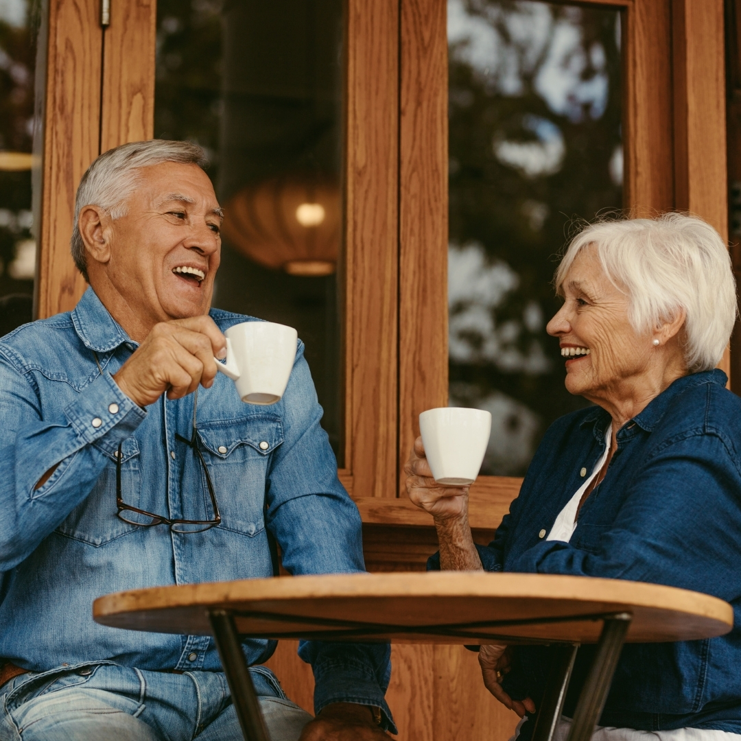 Elderly parent and caregiver discussing assisted living