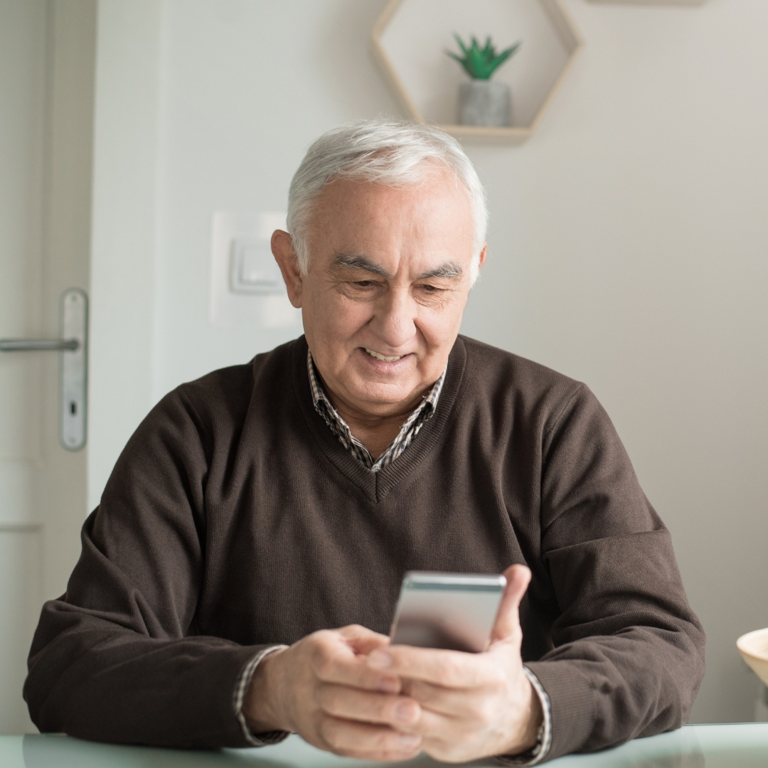 Family reading an assisted living guide on a tablet at home