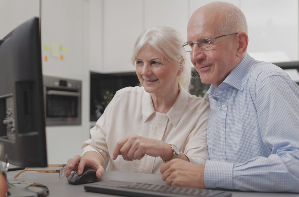 Family searching online for retirement community options at night