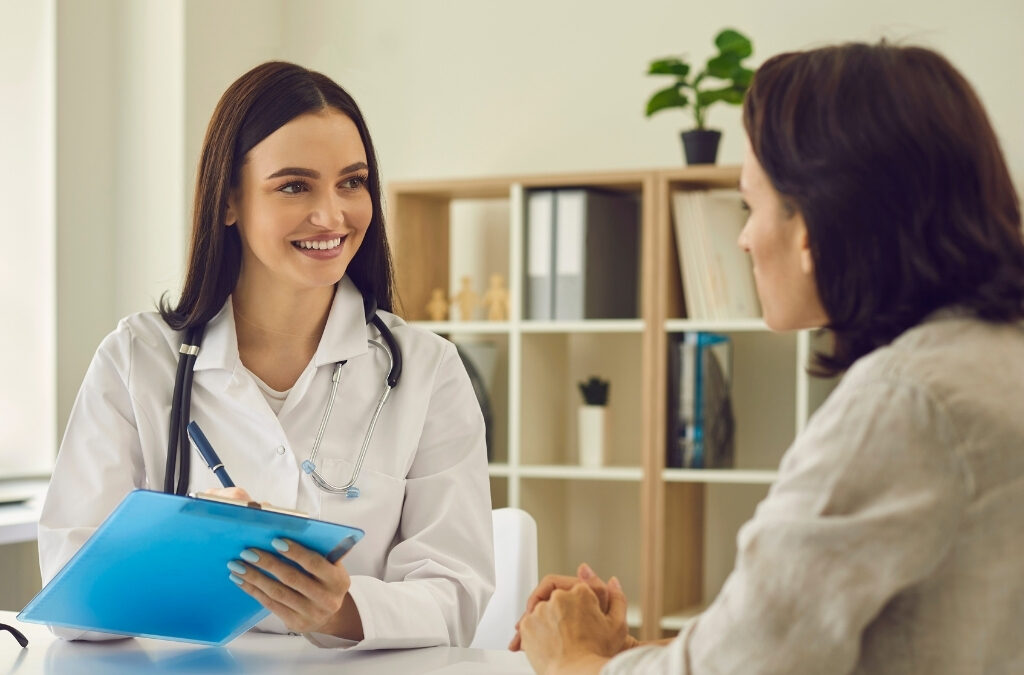 Clinic website homepage displayed on a smartphone and laptop