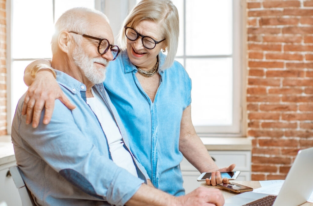Senior using tablet in modern retirement community lounge