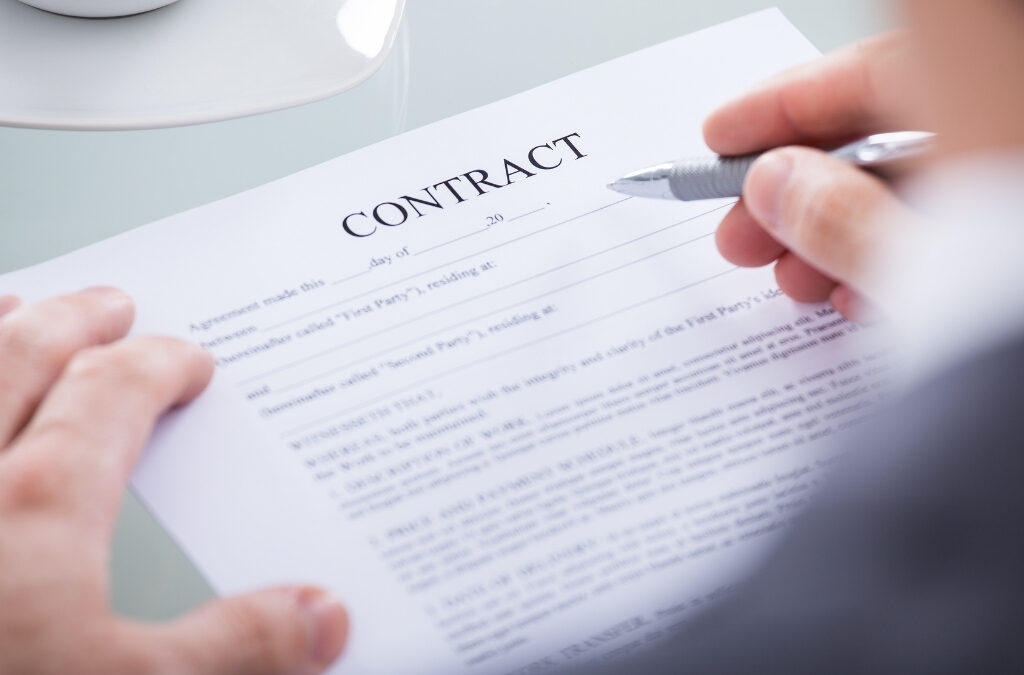 Business professional reviewing government contract documents and compliance requirements.